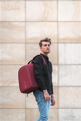 XDDESIGN BOBBY HERO Anti-theft Backpack in rPET material Red (2) anti theft backpack man holding backpack